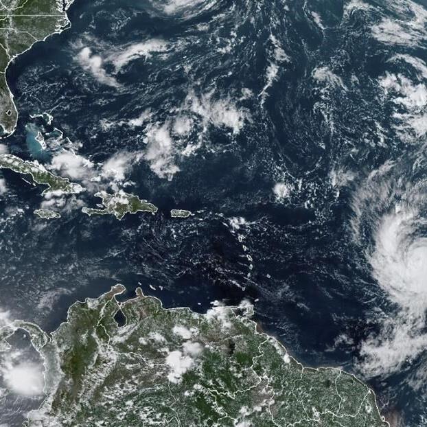 Hurricane Lee barrels through open Atlantic waters after becoming season's first Category 5 storm